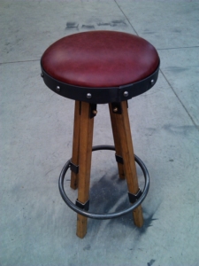 Round leather top, wooden leg bar stool